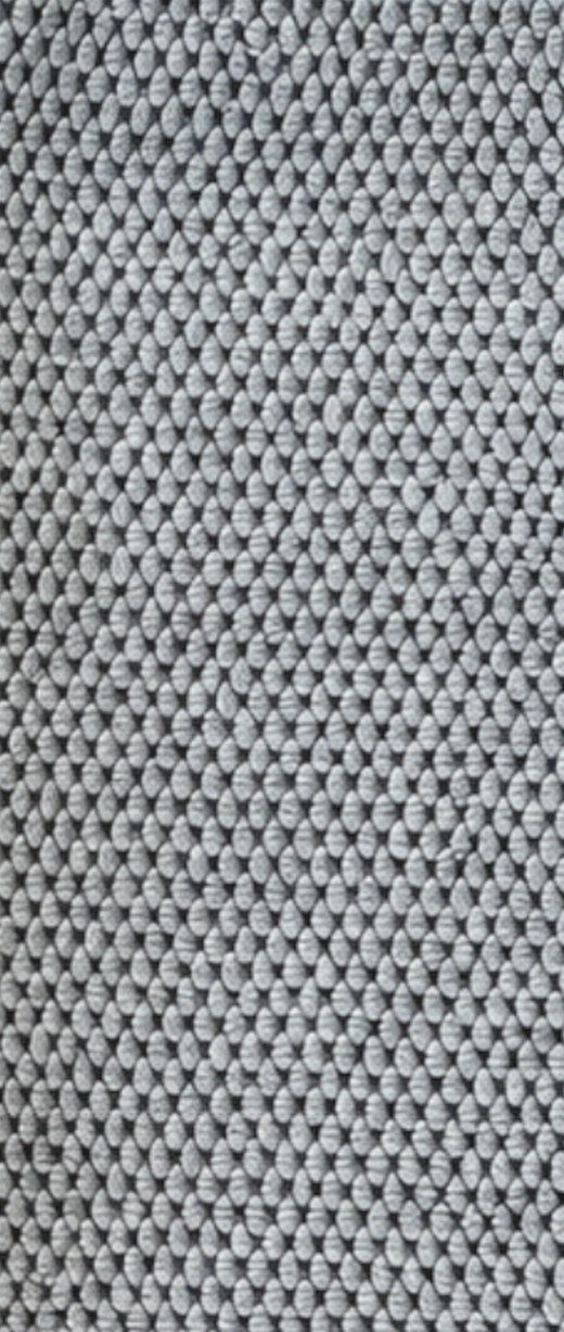 Close-up of the raised pebble texture on a gray Solyra kitchen cloth